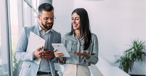 Couple reviewing property plans with Eagle Peak Conveyancing professional.