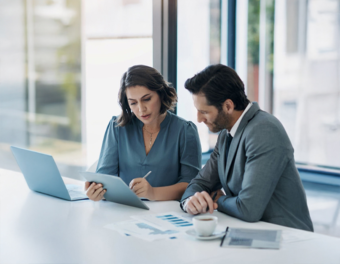 Eagle Peak commercial conveyancers reviewing a contract and digital documents for a client's business property transaction.