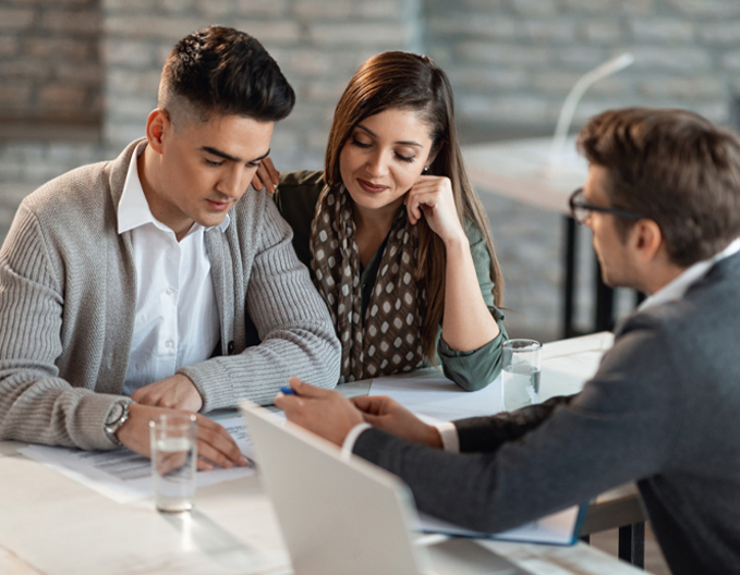 Eagle Peak conveyancer in Pakenham reviewing property documents with a couple for a stress-free purchase or sale.